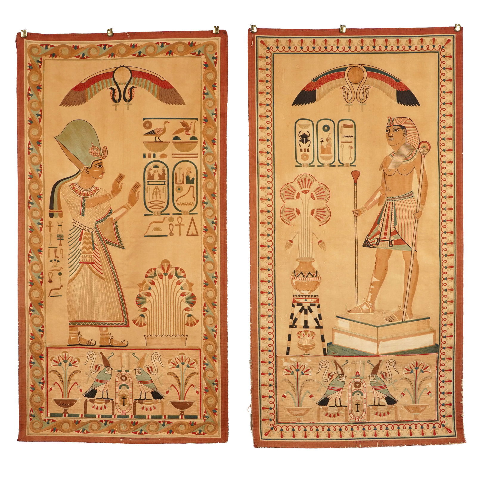 Lot of Two Ancient Egyptian Revival Panels: Lot of two ancient Egyptian revival panels. The complimentary pair depict a Pharoah and his wife reminiscent of ancient hieroglyphics. Designed using stitched appliques. Dimensions: 66 x 34 1/4 inches