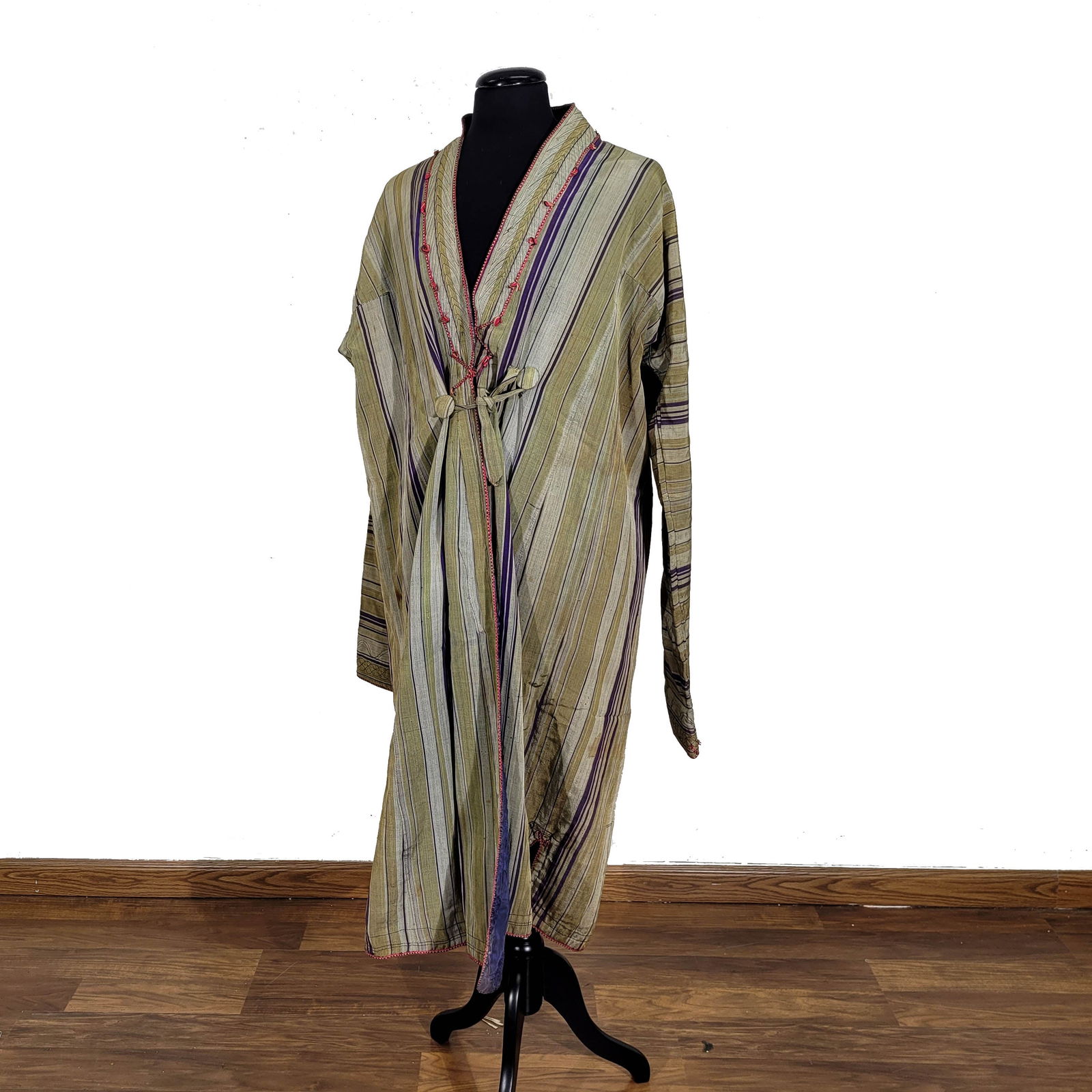 Persian/Central Asian Ikat Silk Robe: Persian/Central Asian Ikat silk robe. The outer shell pattern features large vertical green, eggplant, and celadon stripes while the inner lining is floral. Some wear and stainage consistent with age