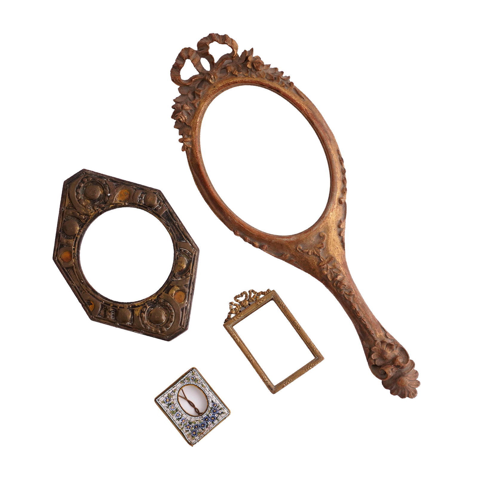 Group of Decorative Picture Frames and Hand Mirror: A mixed group of decorative frames and related articles, comprising a large gilt hand mirror frame with floral and ribbon crest, a small gilt rectangular picture frame, an octagonal metal frame with c