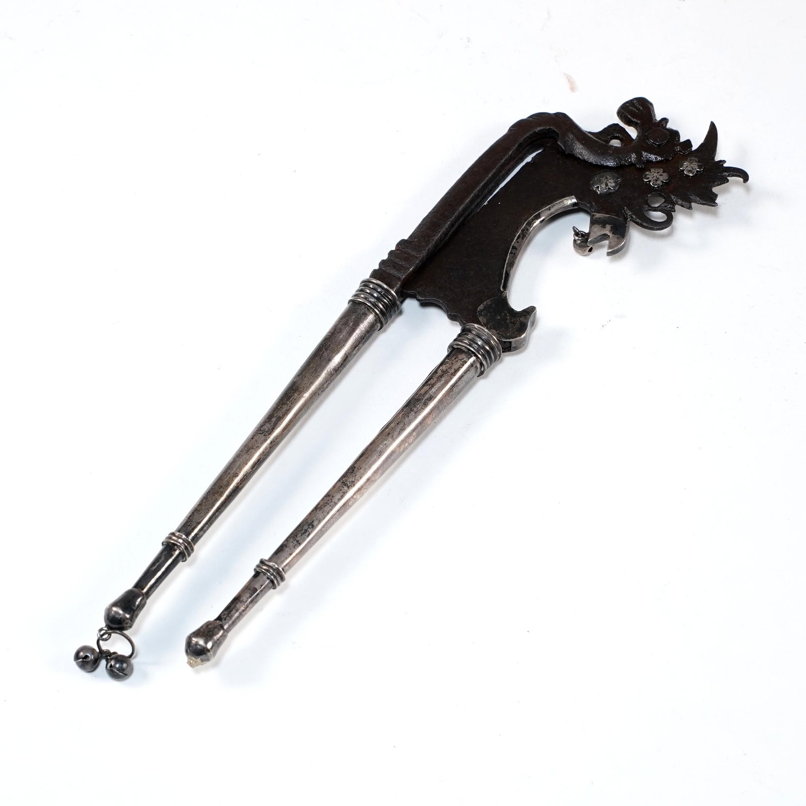 Antique Betel Nut Cutter: Indonesian betel nut cutter, also known as a kacip. Silver handles and an iron blade. 19th century. 8.5" x 2.5" W