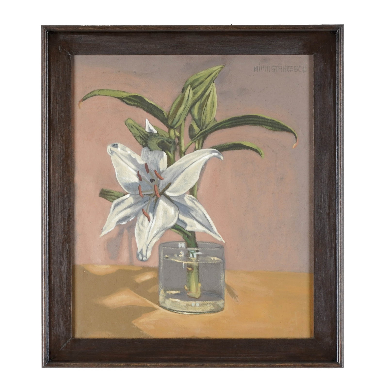 Mihai Stanescu, Framed Lily Still Life: Oil on canvas depicting a white lily with buds and green leaves in a clear glass vessel, set against a warm peach ground. Signed upper right Mihai Stanescu, framed under glass in a dark wood frame. W: