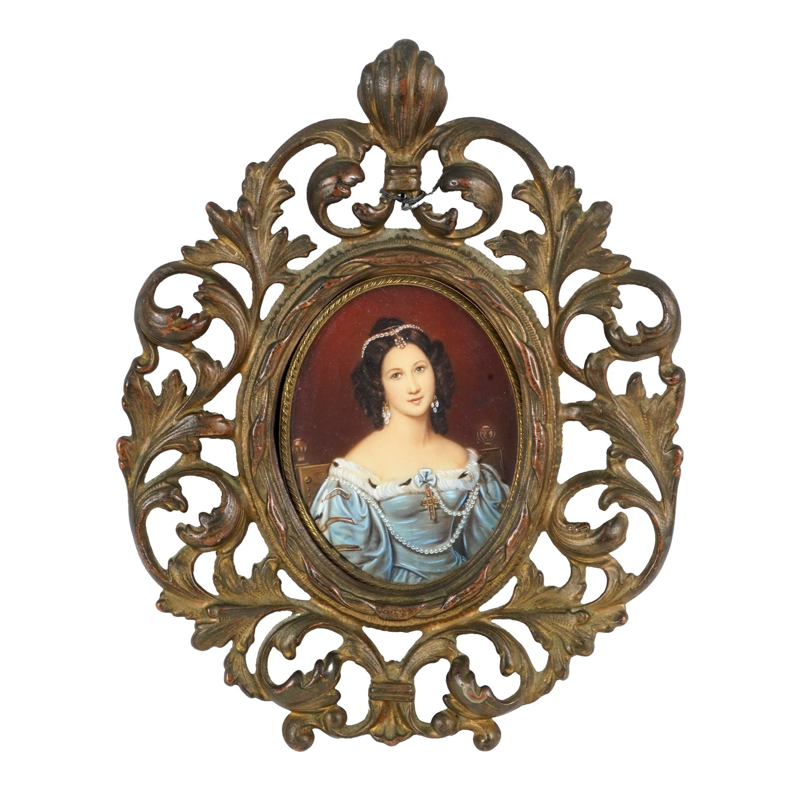 Framed Portrait Miniature of a Lady: Oval portrait miniature depicting an elegant lady in a blue off-the-shoulder gown with pearl jewelry, earrings, and pendant cross, set against a red background. Housed in an ornate pierced gilt-metal