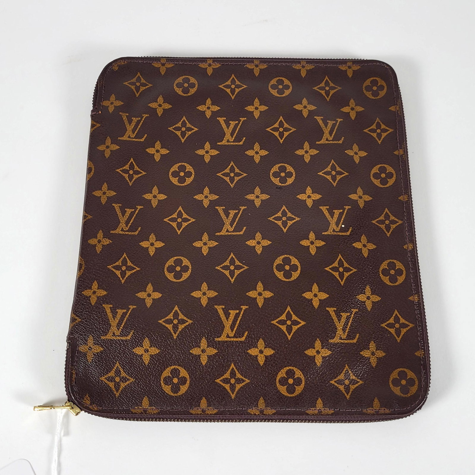 Louis Vuitton Monogram Poche Documents Portfolio Case: Louis Vuitton zippered Portfolio. Brown monogram canvas exterior and brown cross-grain leather interior. 11.5" L x 10" W Property from the estate of Karin Fiedler. New York, NY.
