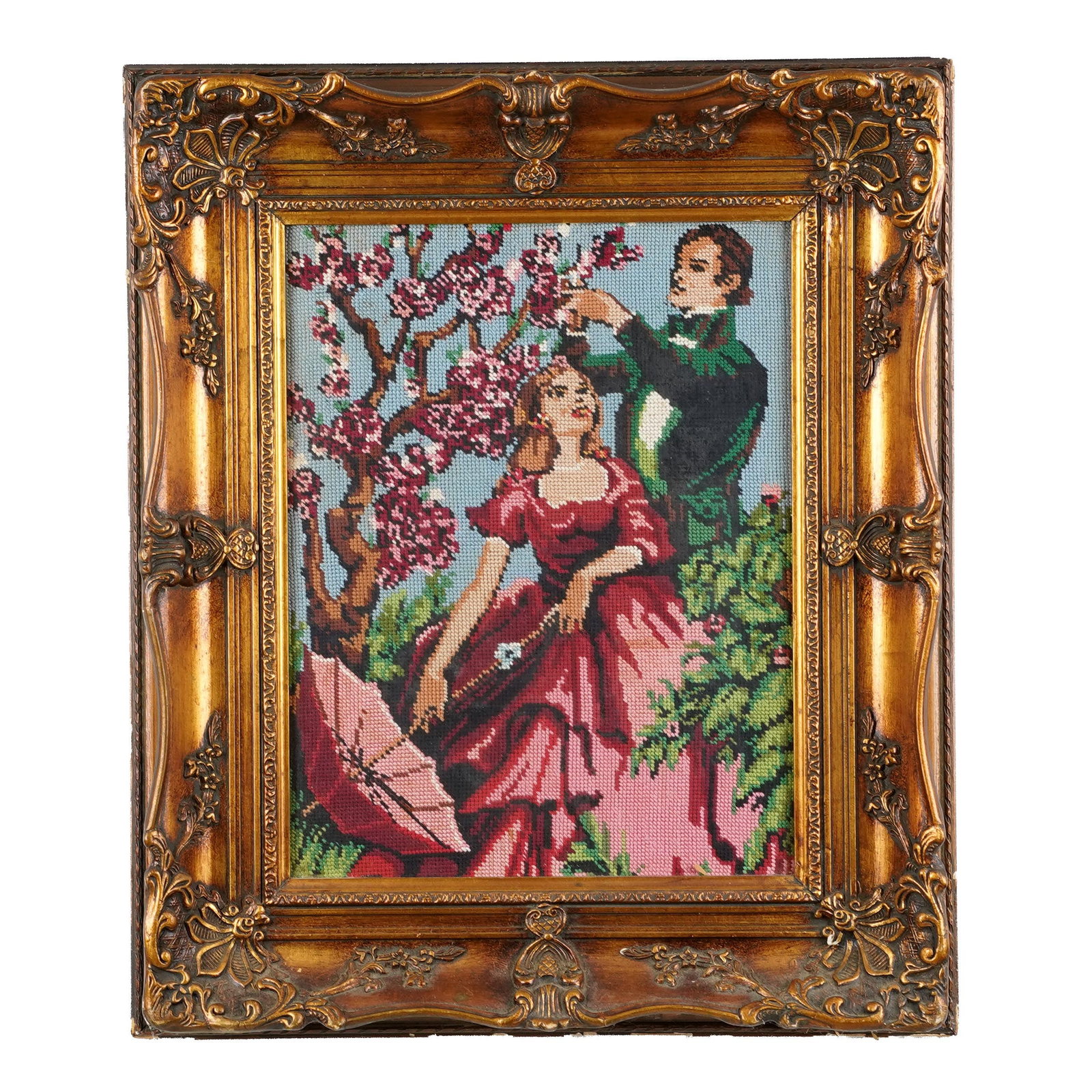 Framed Figural Needlepoint Panel: Framed figural needlepoint panel, romantic garden scene with courting figures beneath flowering tree, worked in colors on canvas, in ornate giltwood frame. L:22 x H:26 1/2 x W: 2 5/8 in. Property