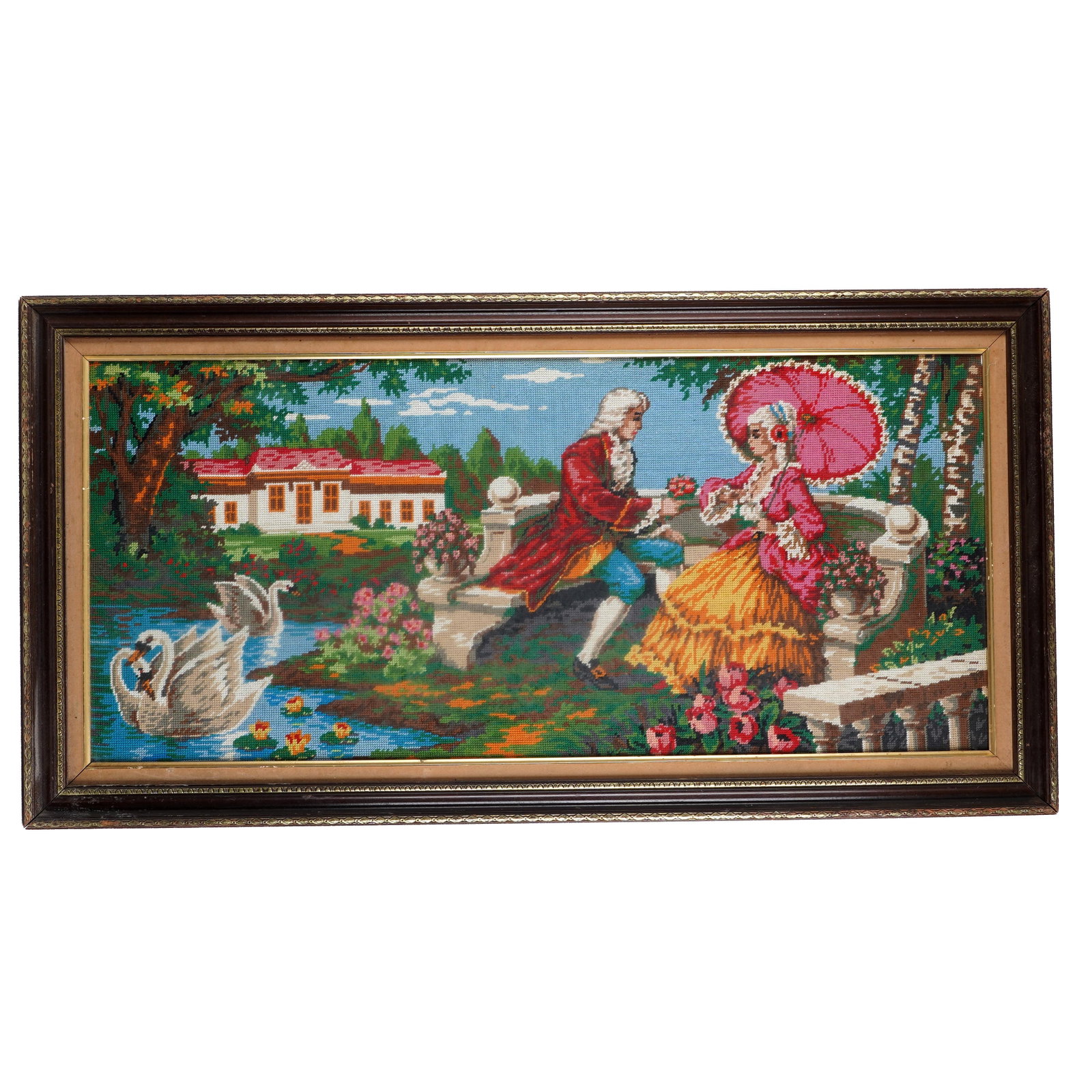 Framed Panoramic Needlepoint Courtship Scene: Framed panoramic needlepoint panel, depicting an 18th-century-style courtship scene in a formal garden with swans, pond, flowers, and distant house, worked in colors on canvas, in dark wood and gilt