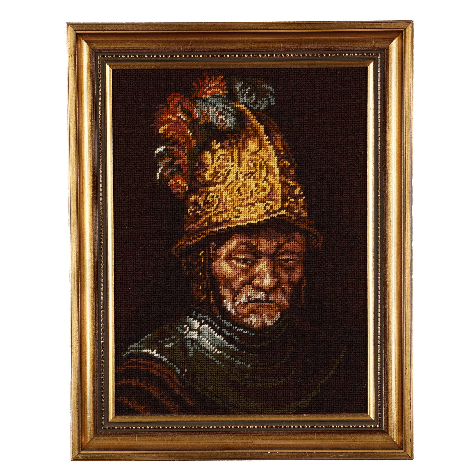 Framed Needlepoint After “Man with the Golden Helmet": Framed needlepoint kit panel after Man with the Golden Helmet, formerly attributed to Rembrandt, depicting an armored man in a gilt plumed helmet. Size: L: 15 1/8 x H: 19 1/4 x W: 1 1/2 in. Property