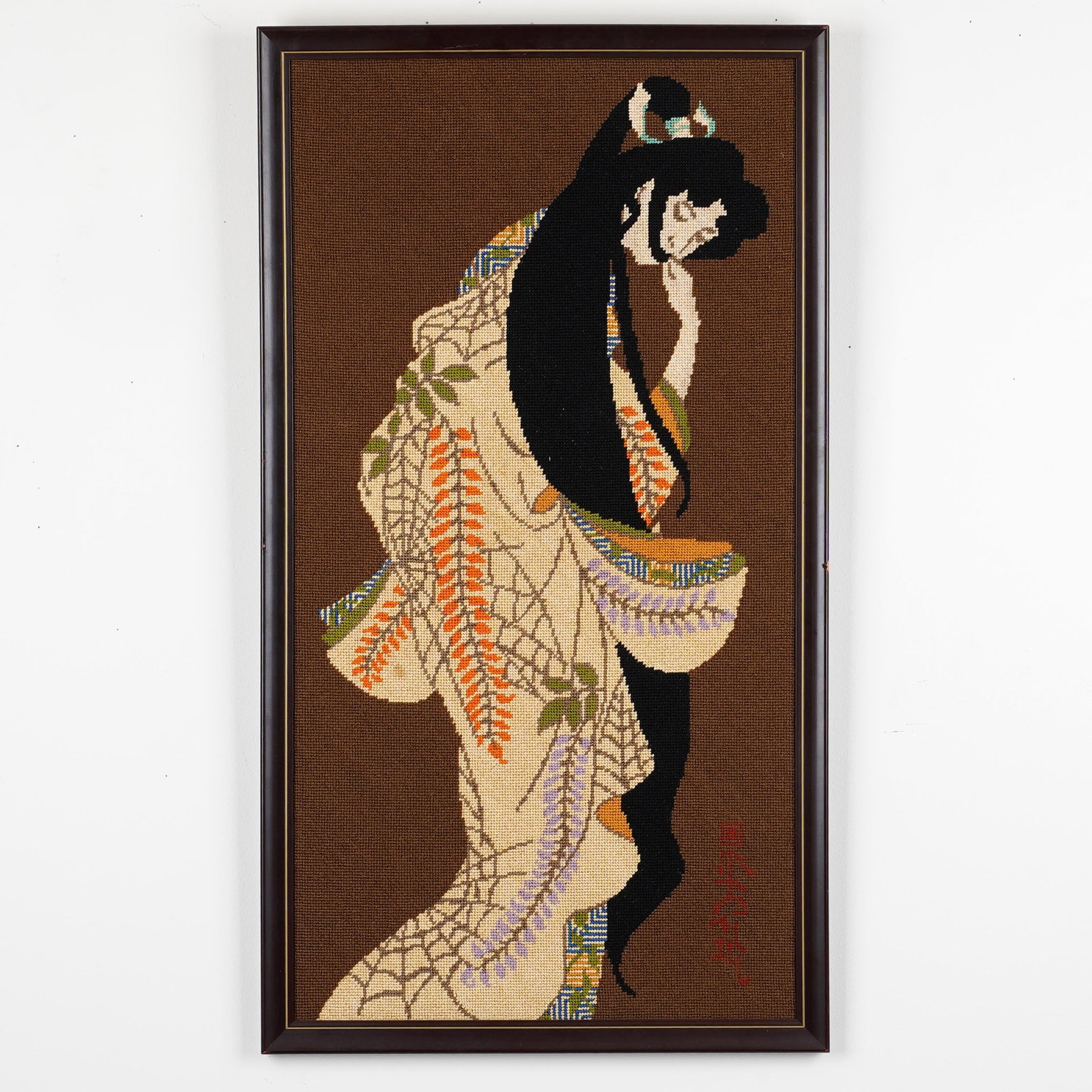 Framed Japanese Needlepoint Geisha Panel: Framed Japanese-style needlepoint textile panel depicting a geisha in patterned kimono, signed/monogrammed lower right, in dark wood frame. H: 30 1/8 x L: 16 3/4 x W: 1 in. Property from the estate