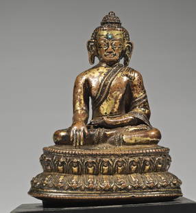 Buddha: bronze rest gilt Nepal, 13th century Buddha mounted lose mounted on a black base. Copper alloy bronze rest gilt. Typically Nepalese, the front worked out very detailed , while the back is kept simple.