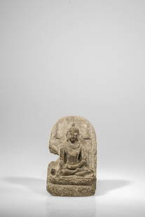 SEATED BUDDHA: Stone with Inscription on the backside China / Tibet , 14th century Dimensions: Height 14 cm Wide 9 cm Depth 4 cm Weight: 652 grams Stone piece of a seated Buddha on a lotus flower showing the