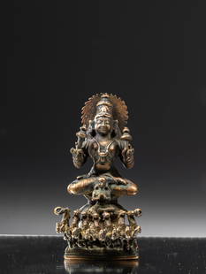 RARE FORM OF SURYA: BronzeIndia 19th century Dimensions: Height 11,5 cm Wide 5,5 cm Depth 6,5 cmWeight: 616 grams Surya is the God of Sun or the personification of the sun.He is shown in his distinctive iconography as