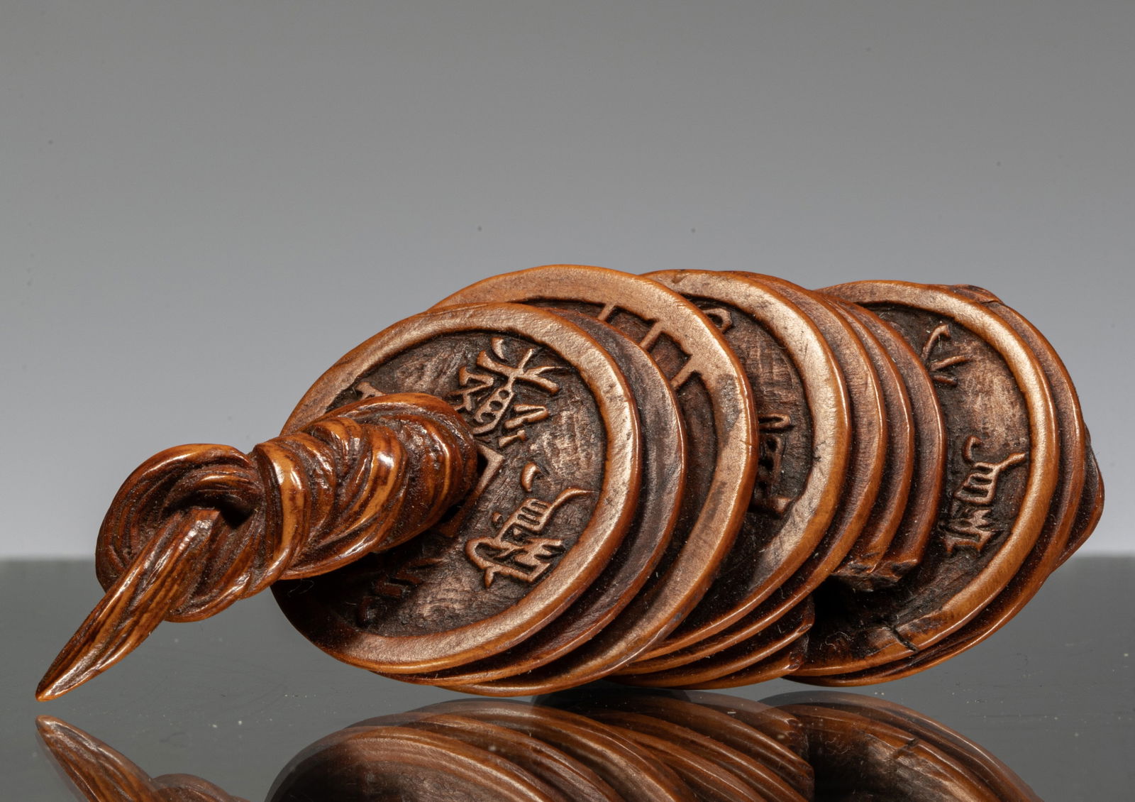 NETSUKE OF A STRING OF CASH COINS (1 of 2)