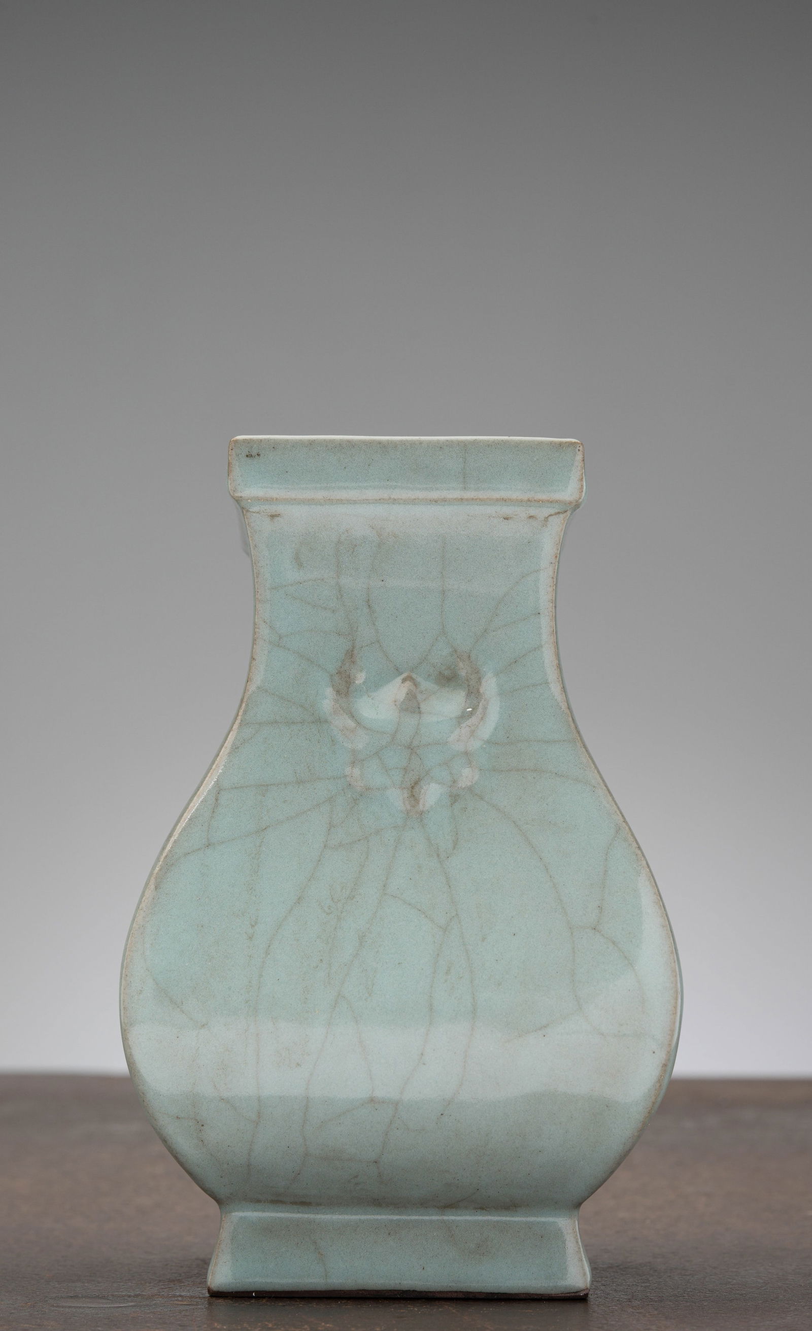 A CHINESE PALE CELADON-GLAZED SQUARE-SECTION VASE, QING DYNASTY (1 of 6)