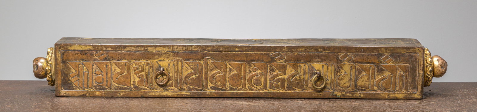 A VERY IMPORTANT THANGKA BOX, HEAVY COPPER REPOUSSE WITH RESTGILDING, TIBET 15TH CENTURY (1 of 12)