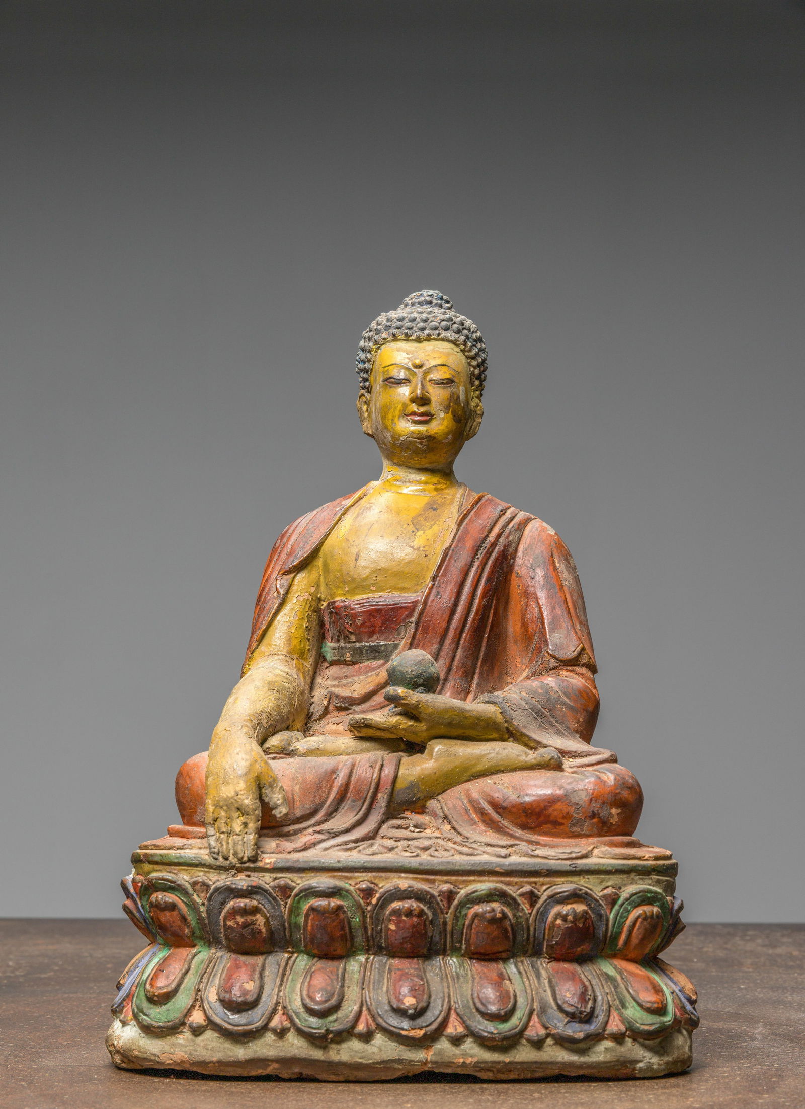 A LARGE TIBETAN CLAY TSA TSA WITH POLYCHROME PIGMENTS DEPICTING BUDDHA AKSHOBYA, 18TH CENTURY (1 of 7)