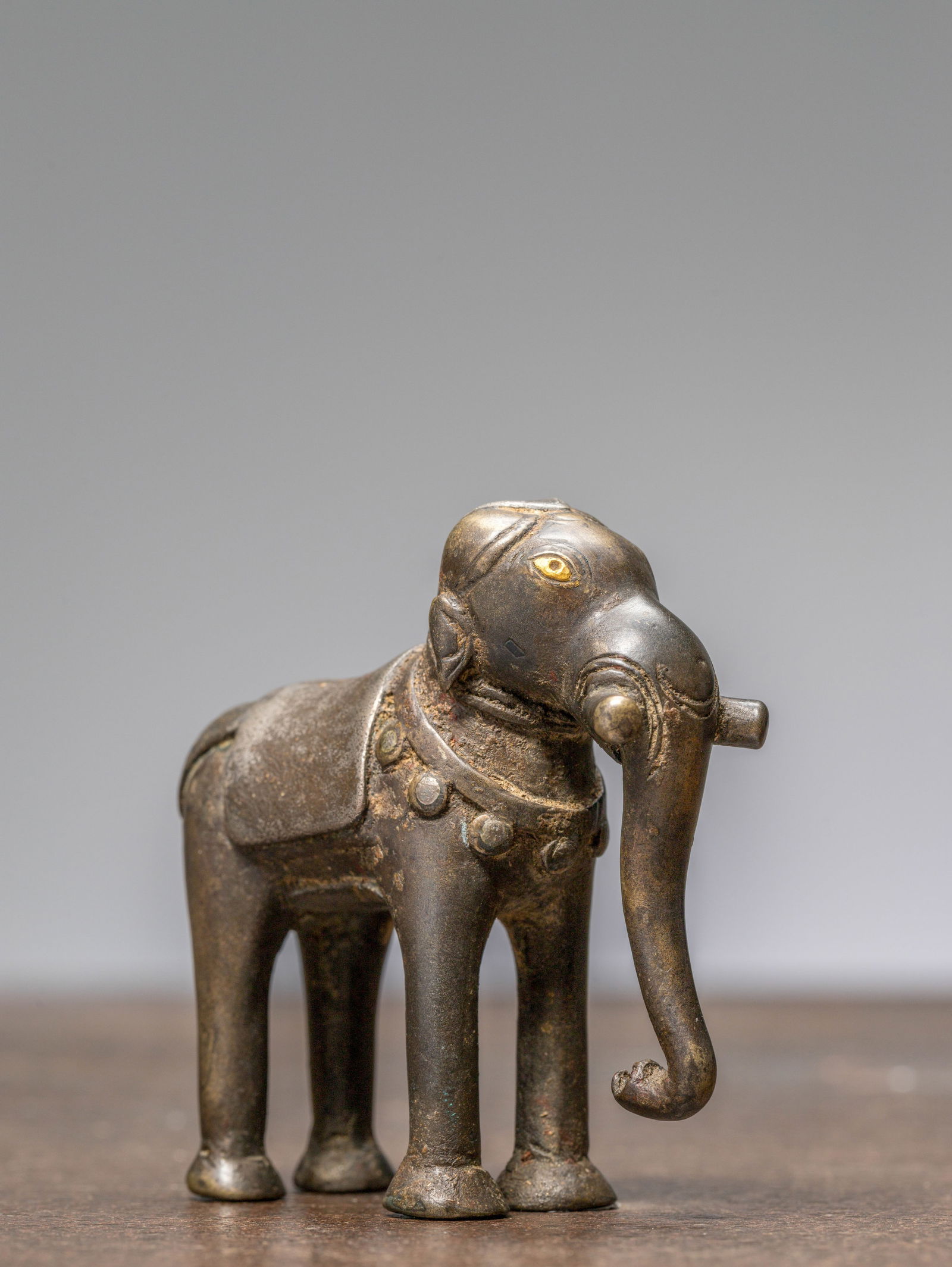 A STANDING BRONZE ELEPHANT WITH SILVER AND GOLD, NEPAL, 18TH CENTURY (1 of 6)