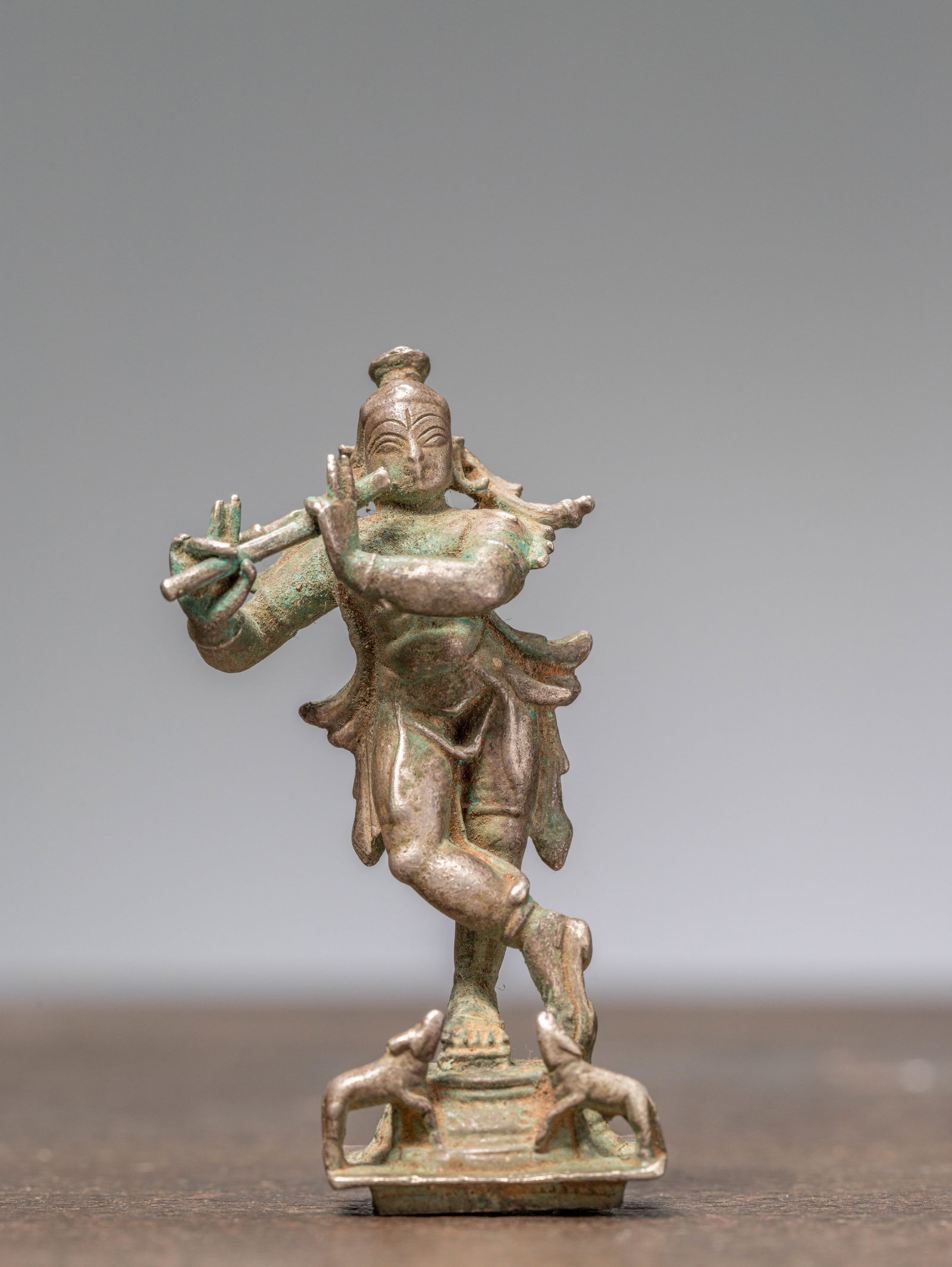 A KRISHNA PLAYING THE FLUTE, SILVER, INDIA 19TH CENTURY (1 of 6)