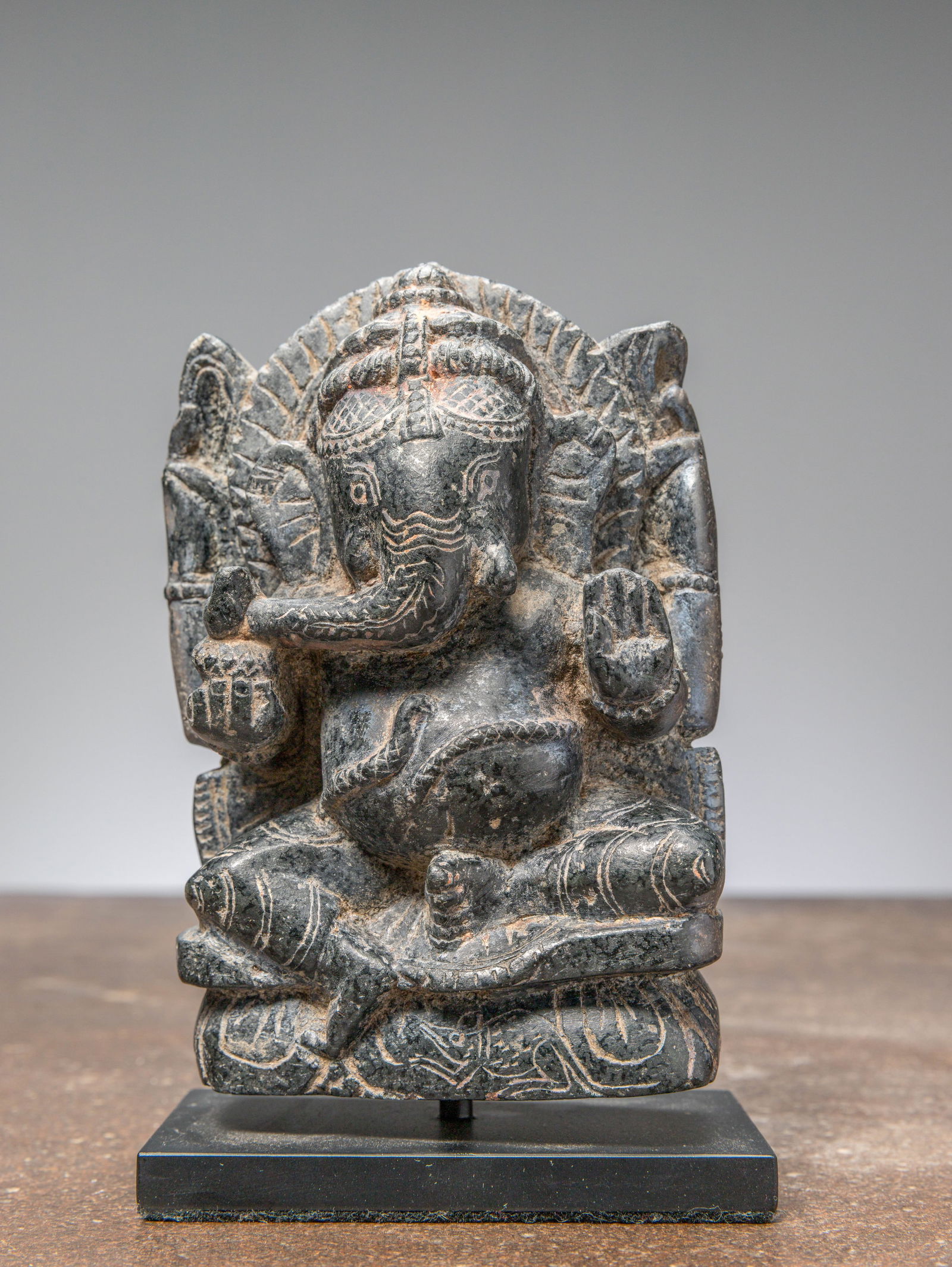 A SEATED STONE GANESHA, INDIA, 18TH TO 19TH CENTURY (1 of 5)