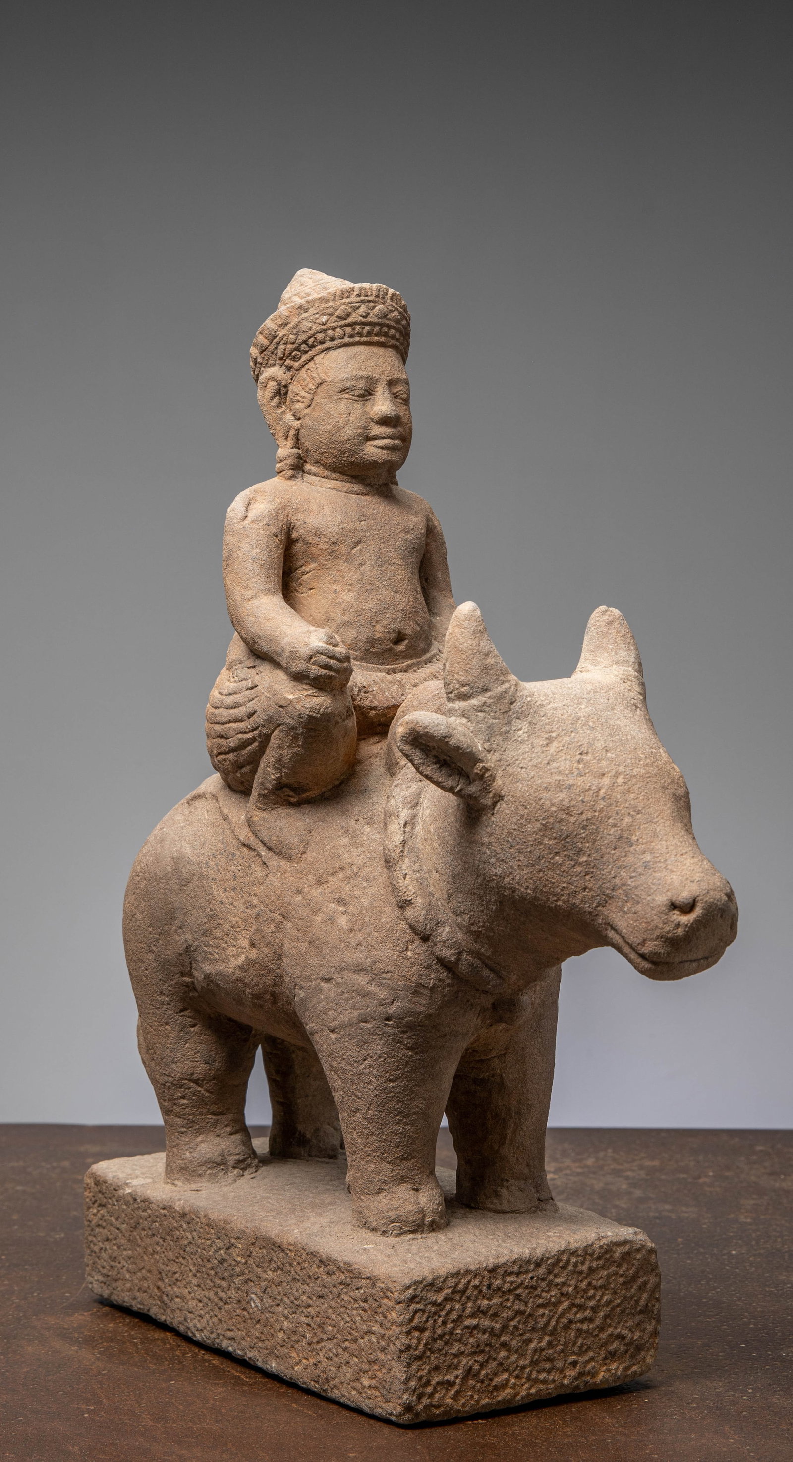 A SANDSTONE FIGURE OF SKANDA RIDING NANDI, KHMER EMPIRE, ANGKOR PERIOD 12TH CENTURY (1 of 6)