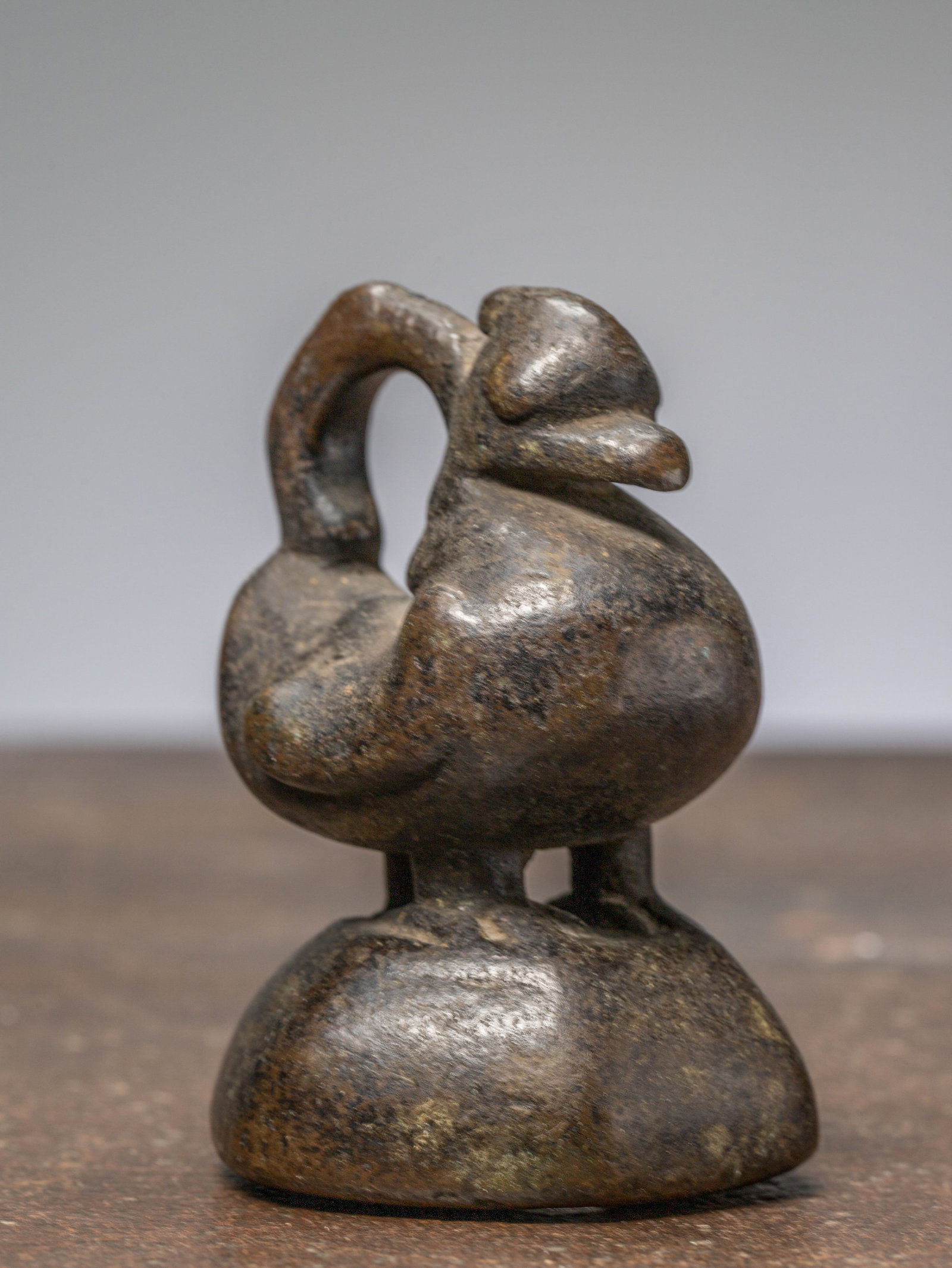 A BRONZE OPIUM WEIGHT, BURMA, 18TH CENTURY IN HINTHA SHAPE (1 of 6)