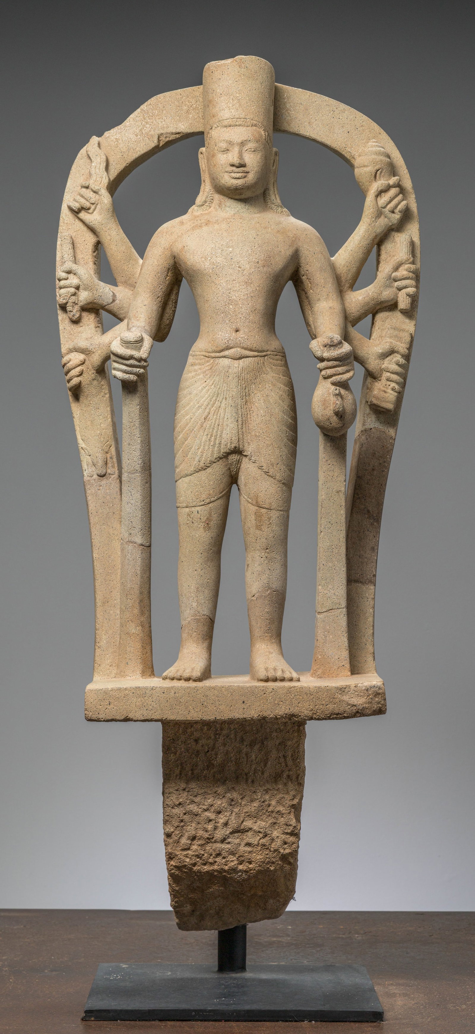 A SANDSTONE FIGURE OF COSMIC VISHNU, KHMER EMPIRE, PHNOM DA STYLE, 6TH TO 7TH CENTURY (1 of 9)