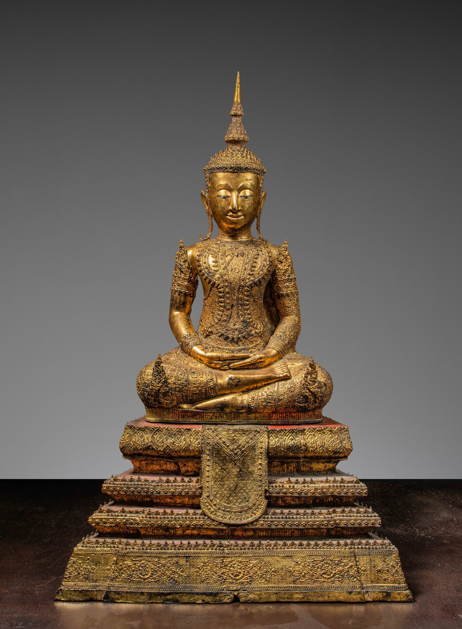 A GILT BRONZE FIGURE OF BUDDHA IN ROYAL ATTIRE, RATANAKOSIN PERIOD, THAILAND APPROXIMATELY 1850'S (1 of 1)
