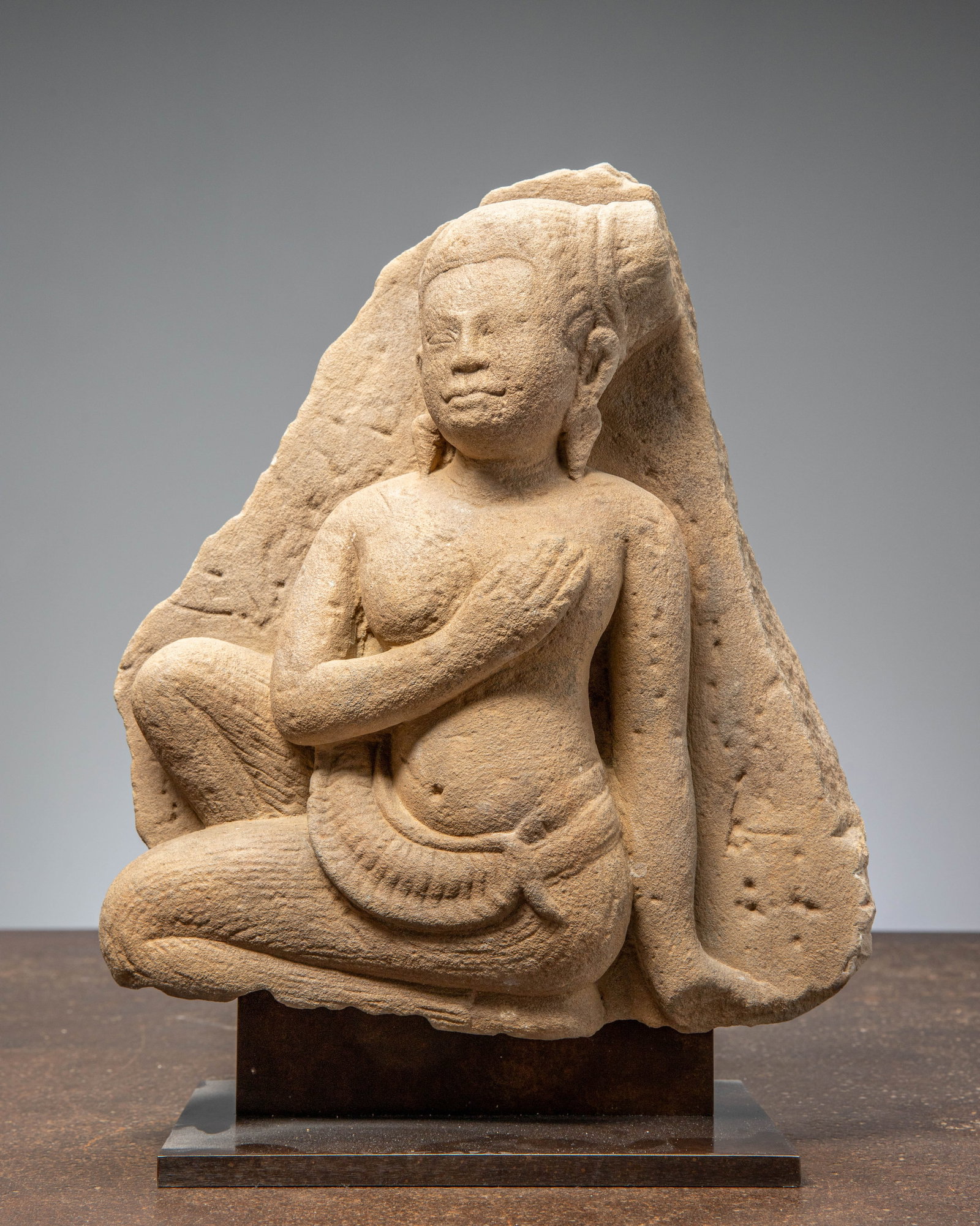 A FRAGMENT OF A KNEEILING KHMER FIGURE (1 of 6)