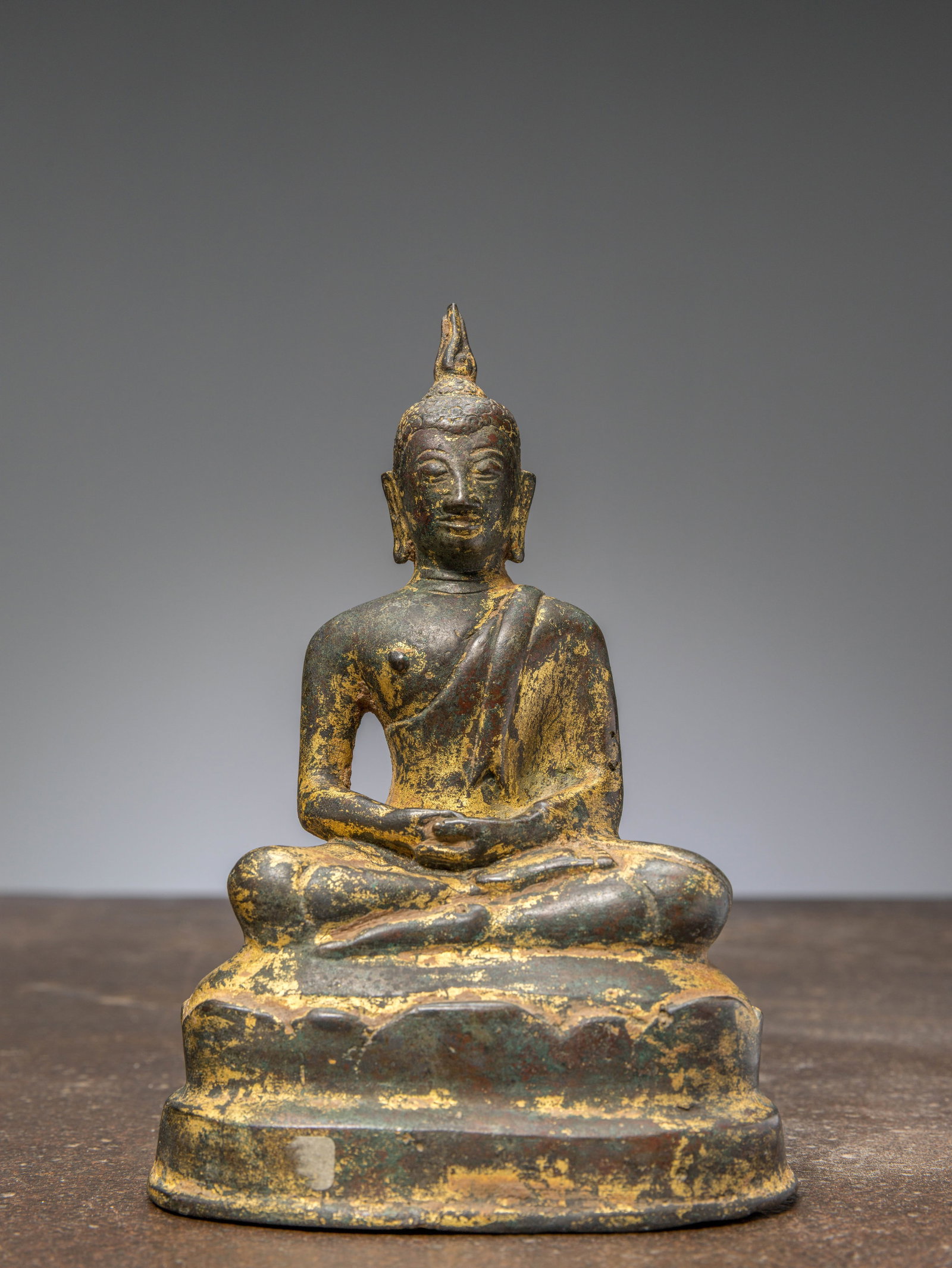 A SEATED BRONZE RESTGILT BUDDHA THAILAND 15TH CENTURY (1 of 6)