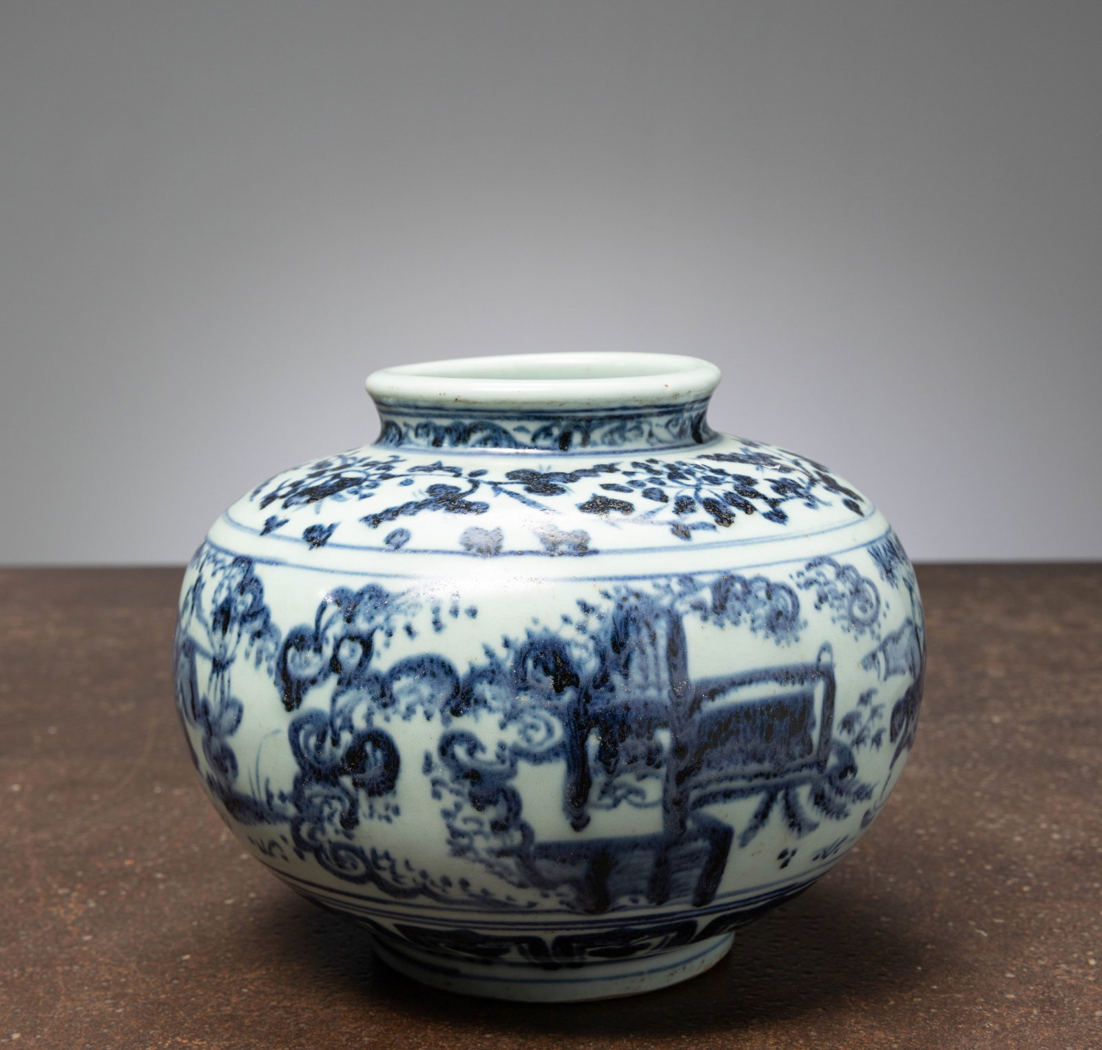 (R) A CHINESE BLUE AND WHITE JAR, LATE MING TO EARLY QING DYNASTY, 17TH CENTURY: Dimensions: Height 15,5 cm Wide 20 cm Depth 20 cm Weight: 1448 grams Of globular form rising from a short foot to a slightly waisted neck, the jar is painted in underglaze cobalt blue with a con