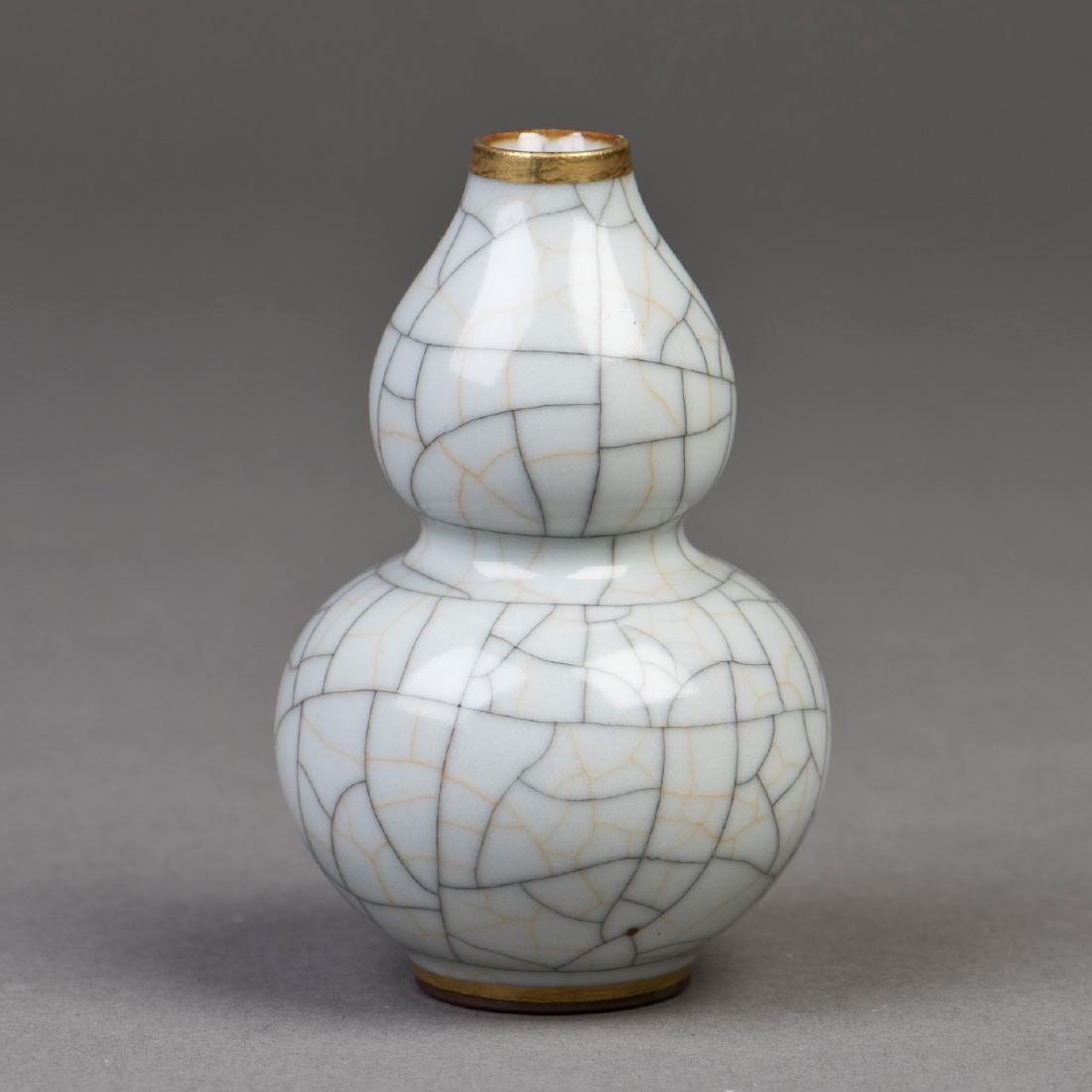 A GOURD-SHAPED CRACKLE-GLAZED PORCELAIN VASE (1 of 3)