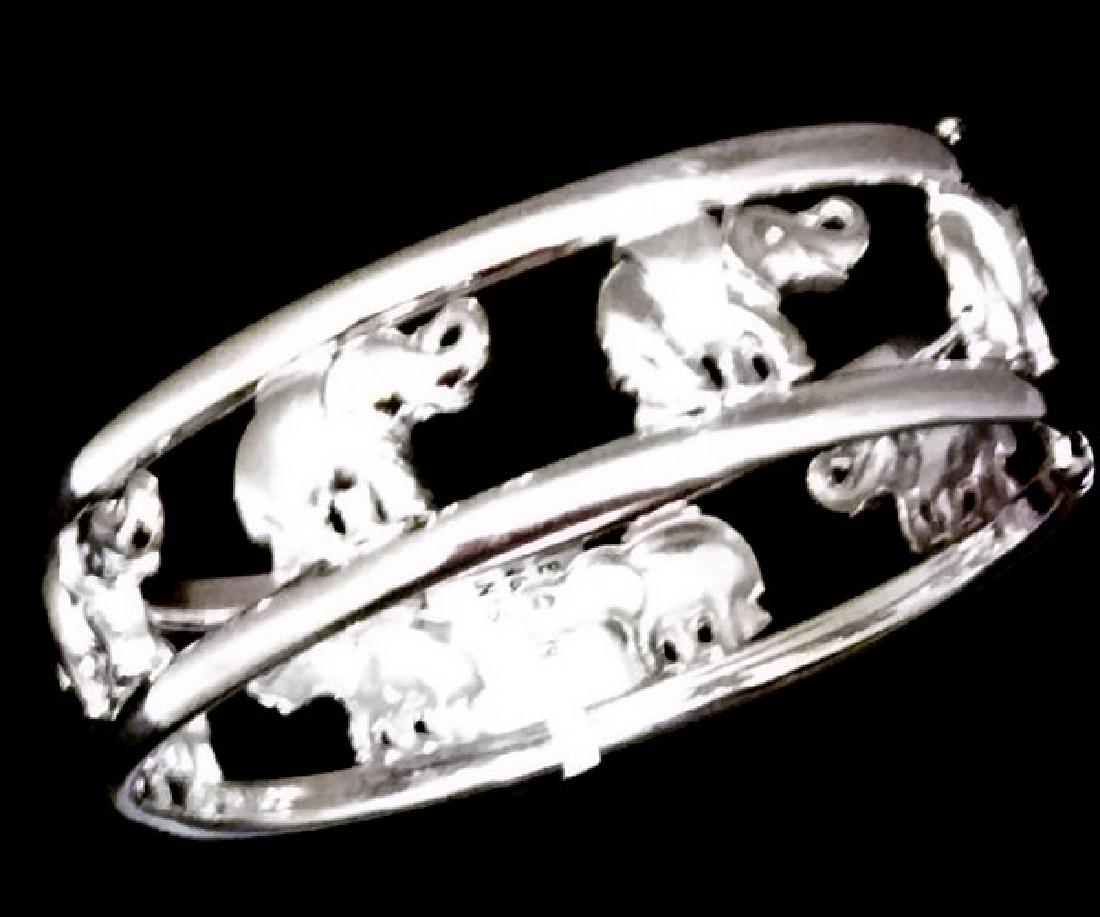 Estate 18K White Gold Hinged Cuff Bangle W. Elephants: Estate 18K White Gold "Elephant Walk" Hinged Cuff Bangle which allows easability for taking On & Off. Stamped "Italy, 750" Dimensions: 24.50mm wide, 5.83mm Thick* Weight: 33.00 grams* * (estimate/appr