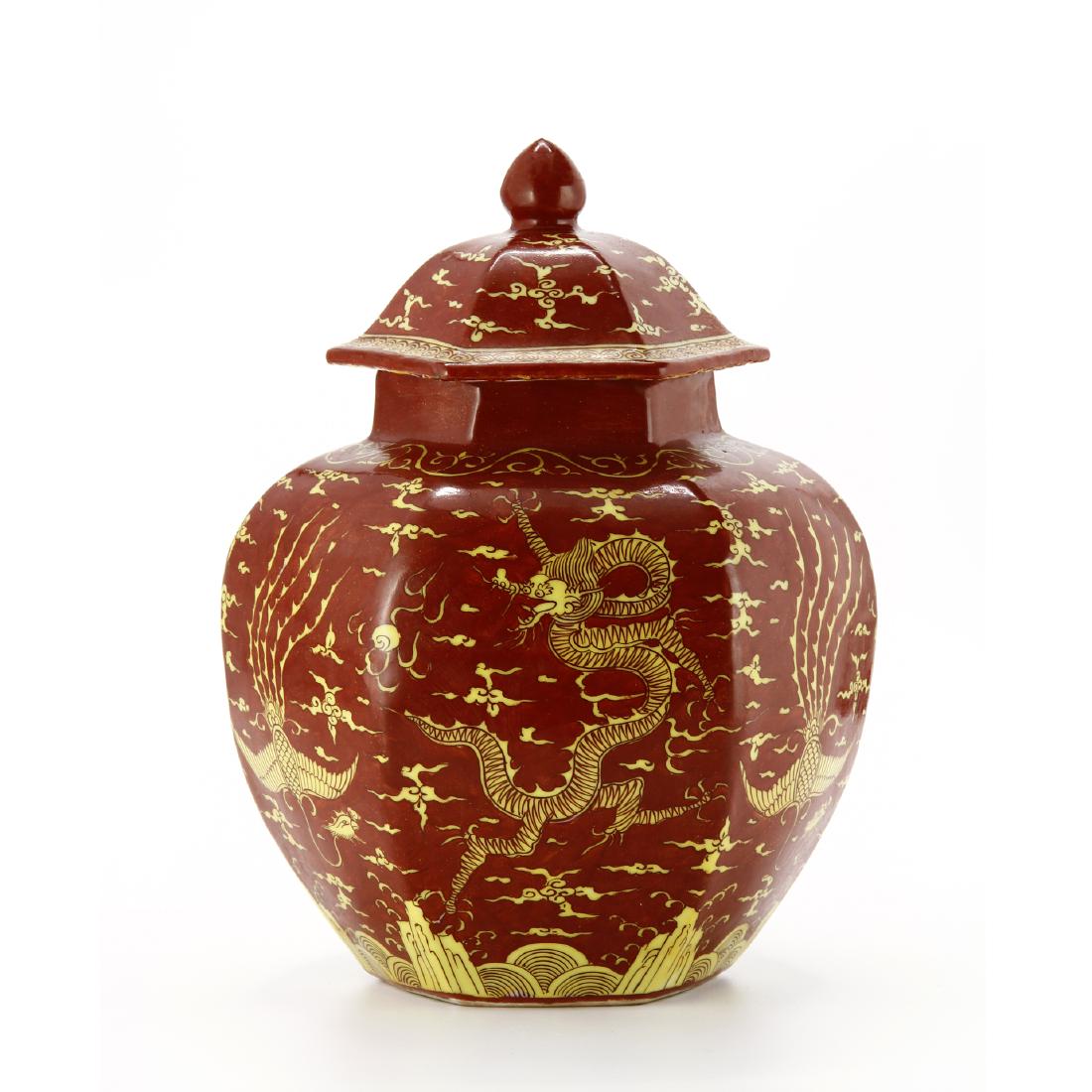 Iron-Red Dragon and Phoneix Jar: Of octagon baluster form with a rounded shoulder and short octagon neck, covered with a transparent and yellow glaze and painted in black with dragons and phoneix among lingzhi scrolls between cloud m