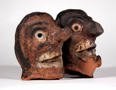 ANTIQUE HISTORIC PRIMITIVE FOLK ART SOUTHERN STYLE POTTERY HEADS / STATUE: The lot consists of two Antique Primitive Folk Art Southern Style Pottery Heads. The size is about 2-3/4". It is hard not to be deeply affected with such raw energy and all in one place, yet such is t