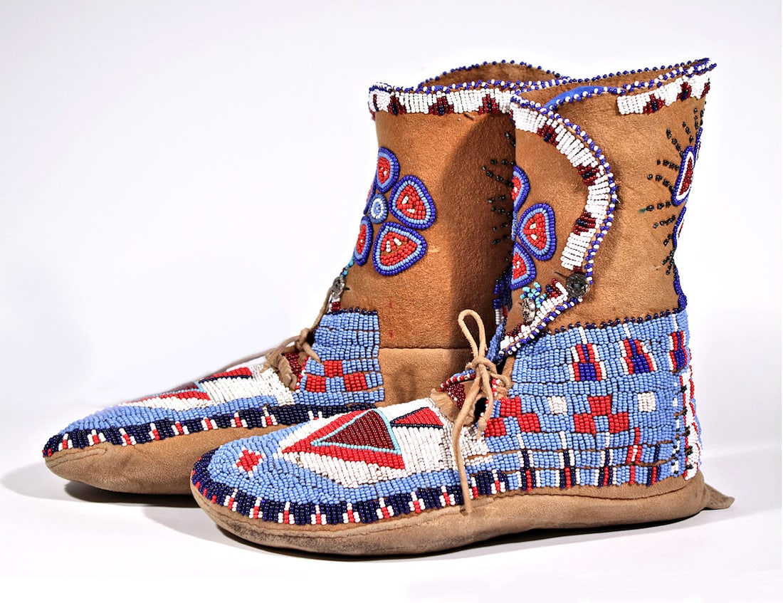 EXCEPTIONAL NATIVE AMERICAN BEADED BOOTS CIRCA 1900'S: An exquisite pair of Native American Moccasins, in excellent condition!Circa Early 1900's .Size 10L" x 9H" x 3.5W" Inches. All items ship from USA.There are no import charges for US customers.We offer