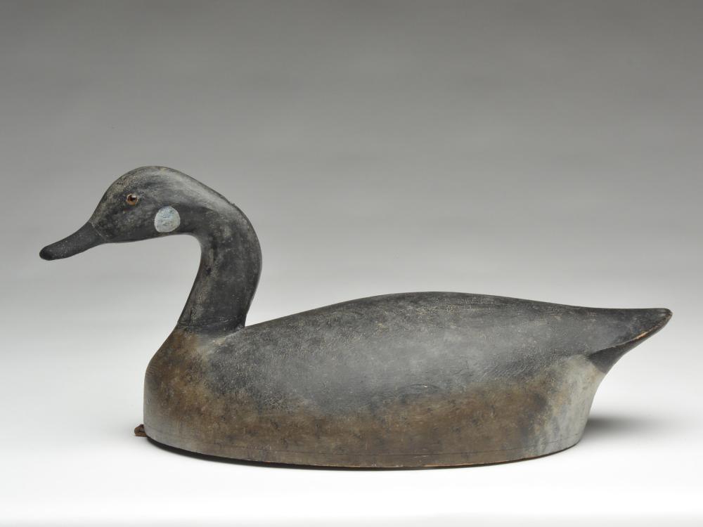 Canada goose, possibly Charles Reeves, Long Point,: Canada goose, possibly Charles Reeves, Long Point, Ontario, 1st quarter 20th century. Branded "W.L - S" in underside. Hollow carved with bottom board. 23" long. Notes: Decoy