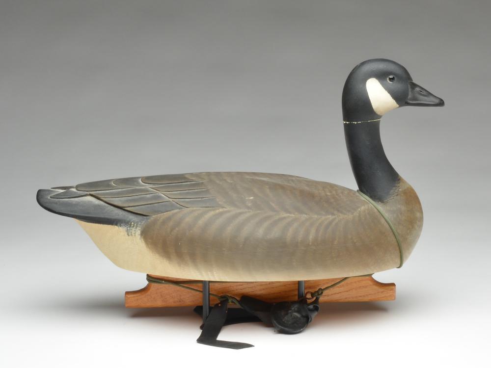 Working Canada goose, Marty Hanson, Hayward, Wisconsin.: Working Canada goose, Marty Hanson, Hayward, Wisconsin. 22" long. Hanson stamp on underside and metal plaque, "Made for Lloyd Griffith 1993 by Martin B Hanson." Detailed wing carving with carved wingt