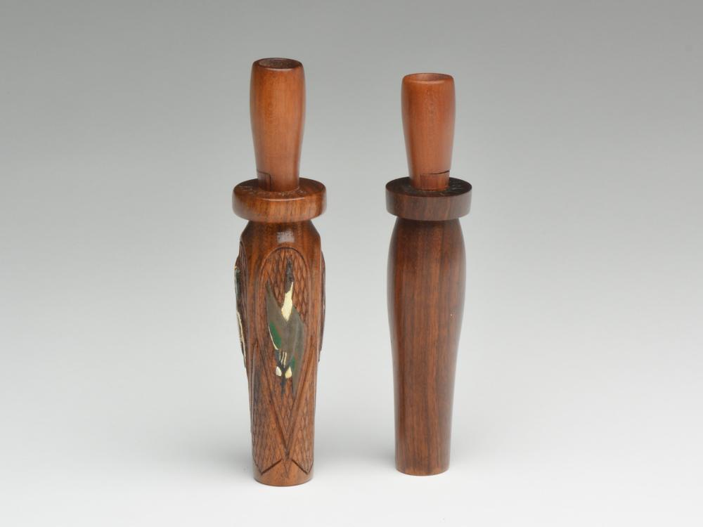 Two duck calls, Fred Jolly, Proctor, Arkansas.: Two duck calls, Fred Jolly, Proctor, Arkansas. Son of noted call maker John Jolly. One is checkered with four panels, each having a carved and painted duck. Marked "F.W. Jolly '35" at top of barrel. O