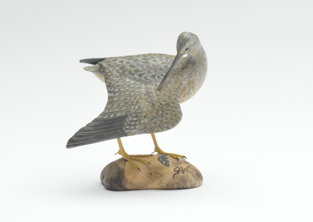 Miniature preening greater yellowlegs, Steve Weaver,: Miniature preening greater yellowlegs, Steve Weaver, Cape Cod, Massachusetts. Signed "SAW" on side, signed on underside. 4.25" tall. Condition Very good and original. Provenance Decoy