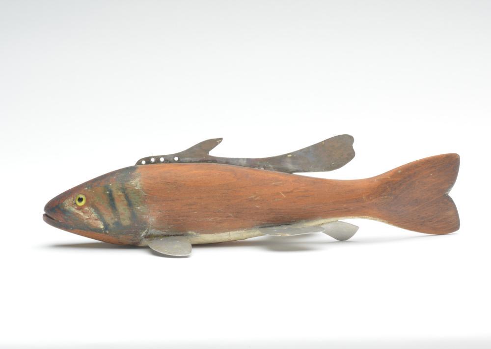 Fish decoy, Hans Janner, Mount Clemens, Michigan.: Fish decoy, Hans Janner, Mount Clemens, Michigan. Small mouth bass. Natural side body with painted head and belly. Glass eyes. 11.5" long. Condition Nice worn patina; multiple layers of paint on under