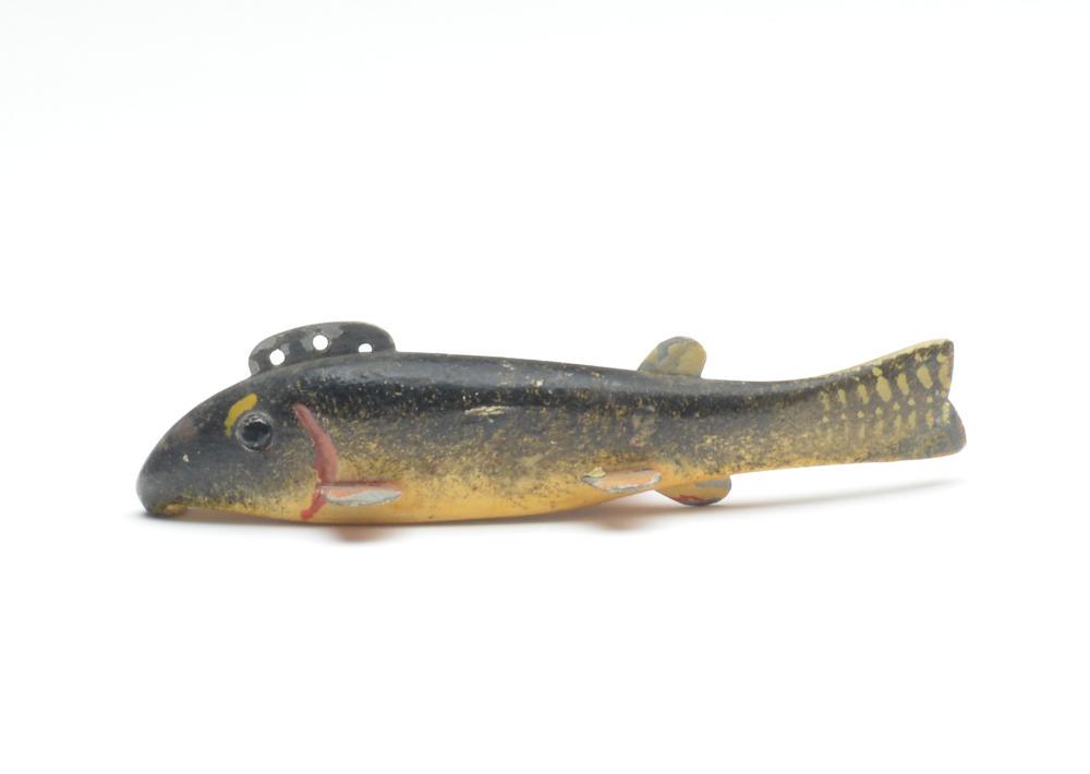 Fish decoy, Oscar Peterson, Cadillac, Michigan, 1st: Fish decoy, Oscar Peterson, Cadillac, Michigan, 1st quarter 20th century. A small sucker fish, 4.75" long x .6" wide x 1" tall. Tack eyes. Condition Strong original paint protected by a coat of varnis