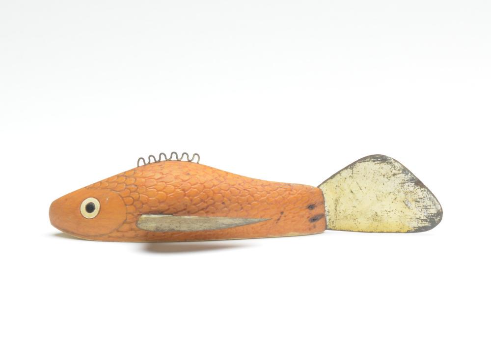 Fish decoy, Leroy Howell, Hinkley, Minnesota.: Fish decoy, Leroy Howell, Hinkley, Minnesota. A fat fish with carved gills. Natural sides with white painted underside. Measures 7.5". Condition Fins have tarnished slightly; otherwise very good and o