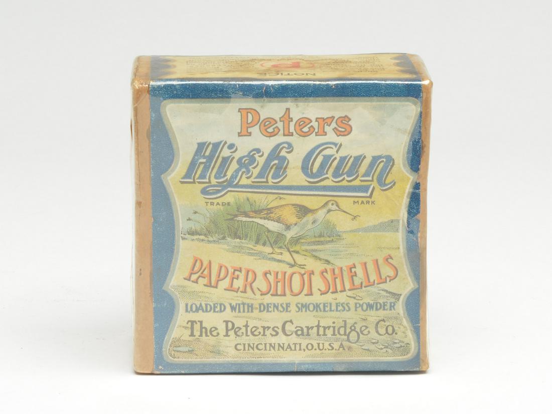 Shotgun shell box, Peters High Gun.: Shotgun shell box, Peters High Gun. 12 gauge with snipe on front label. Buff box with full wrap label. Provenance Formerly in the McCleery collection. Formerly in the Paul Tudor Jones collection.