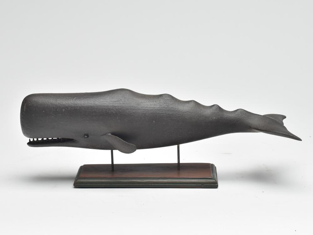 Miniature whale, David Ward, Essex, Connecticut.: Miniature whale, David Ward, Essex, Connecticut. 15" long. Glass eyes with open mouth and teeth. Base is signed on underside. David Ward's initials stamped in underside.