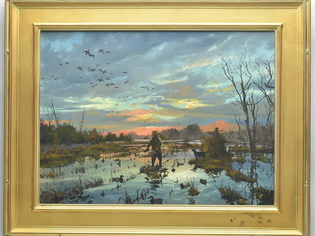 Brett Smith (b.1958), oil on canvas.: Brett Smith (b.1958), oil on canvas. "Winter Wings". Depicts a pair of hunters and lab setting out decoys, with a group of mallards circling above. Signed lower left. Titled and signed on back of canv