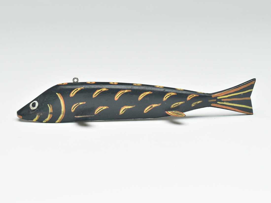 Fish decoy, Frank Mizera, Ely, Minnesota, circa 1930.: Fish decoy, Frank Mizera, Ely, Minnesota, circa 1930. Black fish on fish design. Metal fins with wooden tail. Measures 9" long.