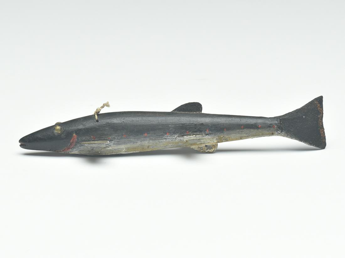 Fish decoy, Lake Chautauqua, New York, circa 1900.: Fish decoy, Lake Chautauqua, New York, circa 1900. Metal fins and leather tail. Carved gills and mouth. Brass tack eyes. Line tie through body. Measures 6.75" long.