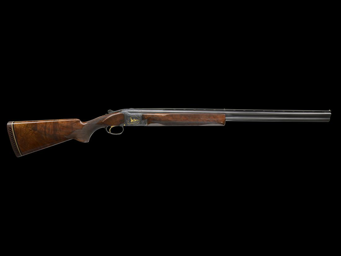 RARE BROWNING SUPERPOSED MIDAS GRADE 28 GAUGE: SN. 1791F8. Made in 1968 with 28” skeet choked bbls, 2-3/4” chambers, that have low profile matted ventilated top rib with twin ivory beads. Bbl lumps and breech end engraved in shaded flo