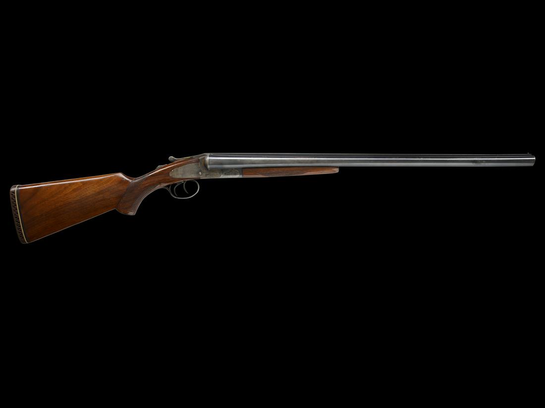 SCARCE, LATE SHORT BARRELED L.C. SMITH FIELD GRADE 12 GAUGE: SN. FWS56470. Made with 26" Armor Fluid Steel bbls, 2-3/4" chambers, that have raised matted rib with brass front bead. Splinter forearm checkered in diamond pattern with blued iron and has late style