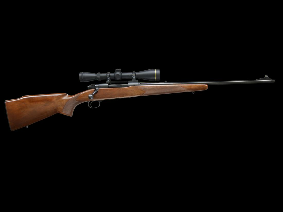 PRE '64 WINCHESTER MODEL 70 FEATHERWEIGHT IN .308 WIN CALIBER: SN. 422441. Made with 22" tapered round bbl that has flip up rear sight and ramp blade front sight. Left side of bbl with usual markings. Right side of receiver with SN and bolt with matching SN. Stoc