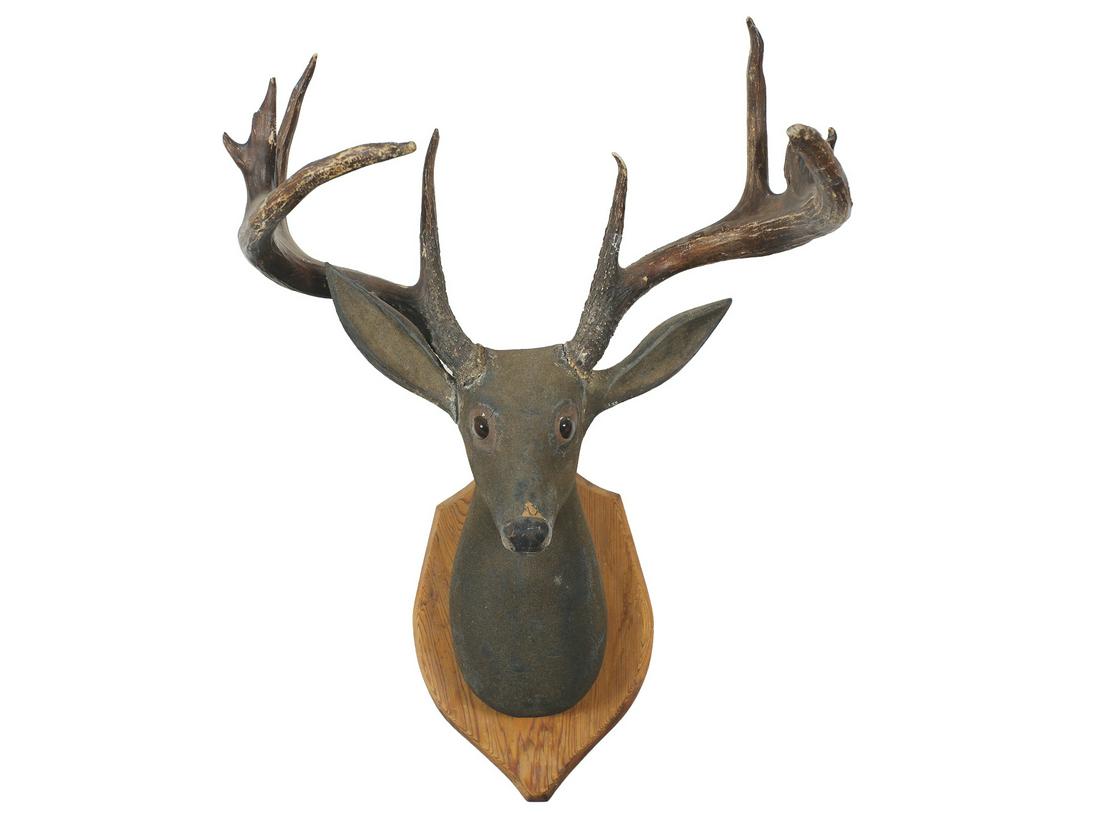 Carved deer head with massive whitetail antlers and glass eyes. (1 of 1)
