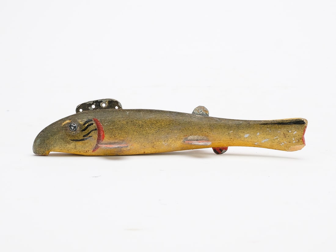 Oscar Peterson (1887-1951), Cadillac, Michigan.: Sucker fish decoy with tack eyes. Measures 7" x 1.25" x .75".